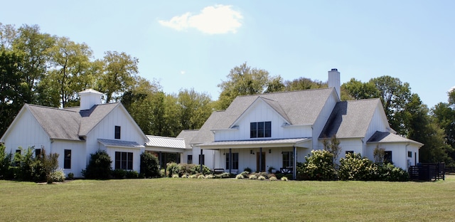 back of house featuring a yard