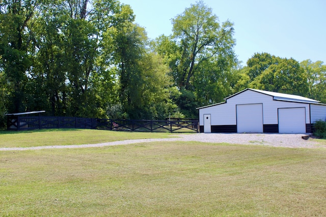 view of yard with an outbuilding and a garage