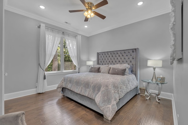 bedroom featuring crown molding, dark hardwood / wood-style flooring, and ceiling fan