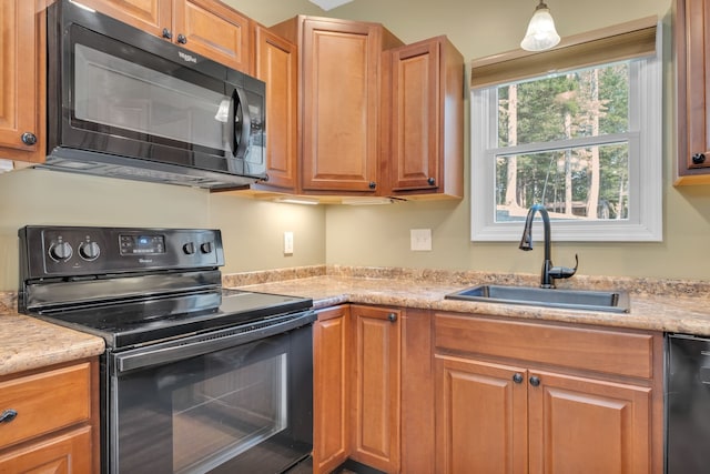 kitchen with black appliances and sink