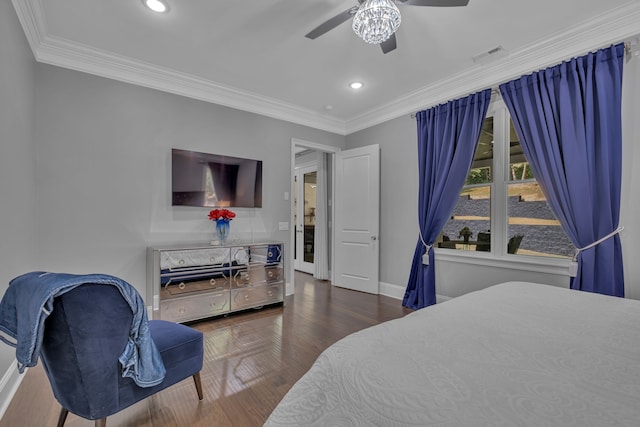 bedroom with ceiling fan, dark hardwood / wood-style floors, and ornamental molding