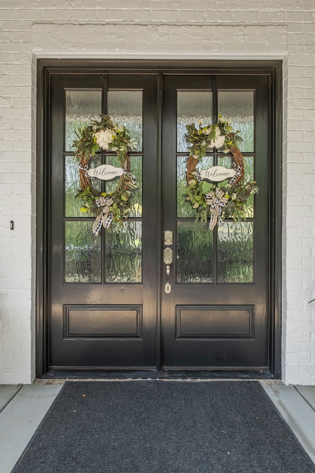 doorway to property featuring french doors