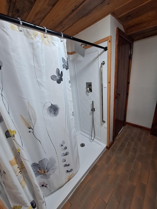 450 Pinson Ln, Big Sandy, TN 38221 - bathroom featuring curtained shower, wood ceiling, and baseboards