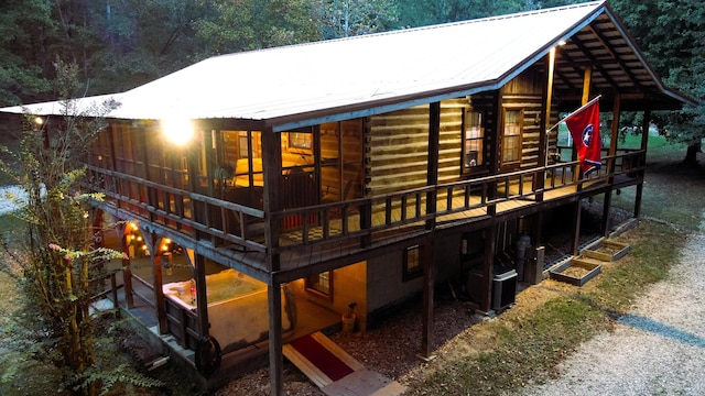 450 Pinson Ln, Big Sandy, TN 38221 - back of house featuring a deck, central AC unit, and metal roof
