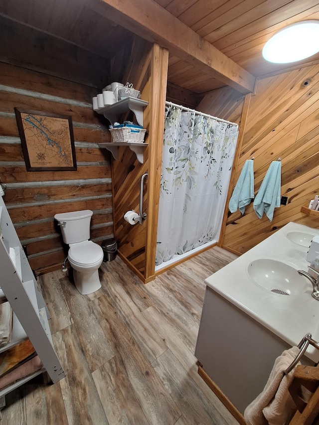 450 Pinson Ln, Big Sandy, TN 38221 - bathroom with wood finished floors, toilet, a sink, beamed ceiling, and wood ceiling