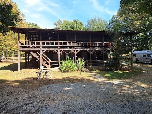 450 Pinson Ln, Big Sandy, TN 38221 - rear view of house with stairway