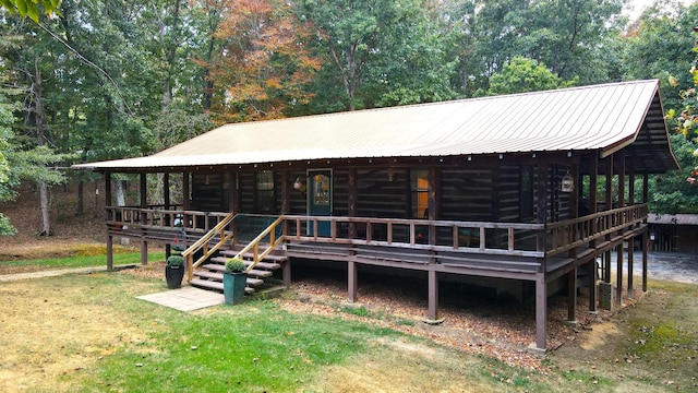 450 Pinson Ln, Big Sandy, TN 38221 - exterior space featuring a yard, central AC, and metal roof