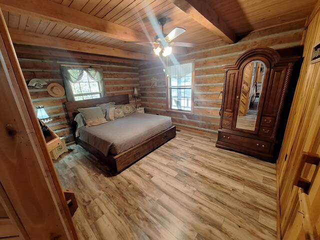 450 Pinson Ln, Big Sandy, TN 38221 - bedroom with wooden ceiling, beamed ceiling, light wood-style floors, log walls, and ceiling fan