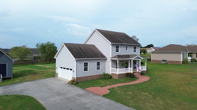 view of front of property with driveway, a shingled roof, a porch, and a front yard