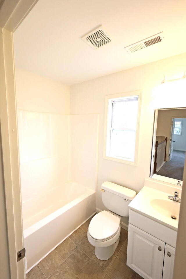 full bathroom with shower / bath combination, toilet, tile patterned floors, and vanity