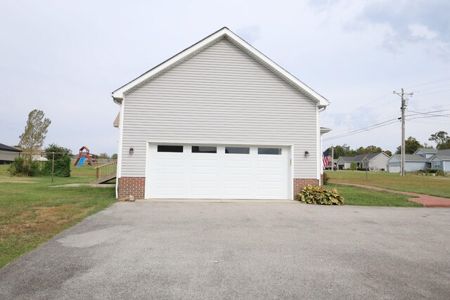 view of property exterior with a playground, a garage, and a lawn