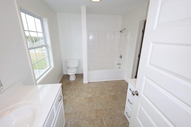 bathroom with baseboards, shower / tub combination, vanity, and toilet