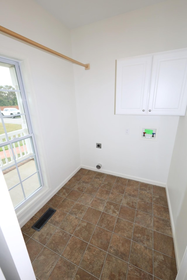 washroom featuring washer hookup, visible vents, hookup for an electric dryer, laundry area, and baseboards