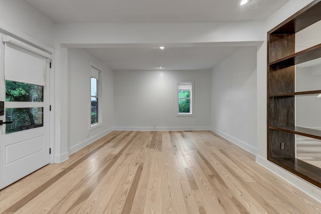 unfurnished room with light hardwood / wood-style flooring