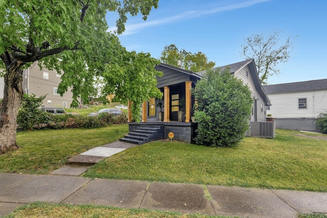 view of front of property featuring a front lawn and central air condition unit