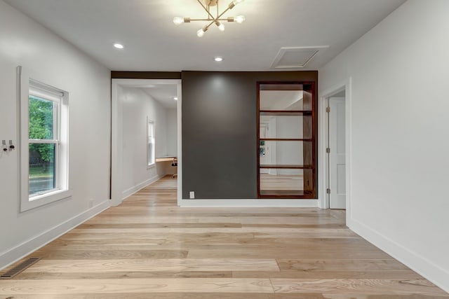 unfurnished room featuring light hardwood / wood-style flooring