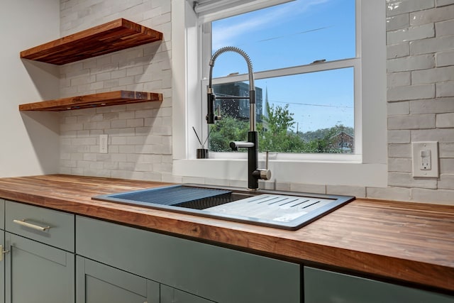 kitchen with butcher block counters and sink