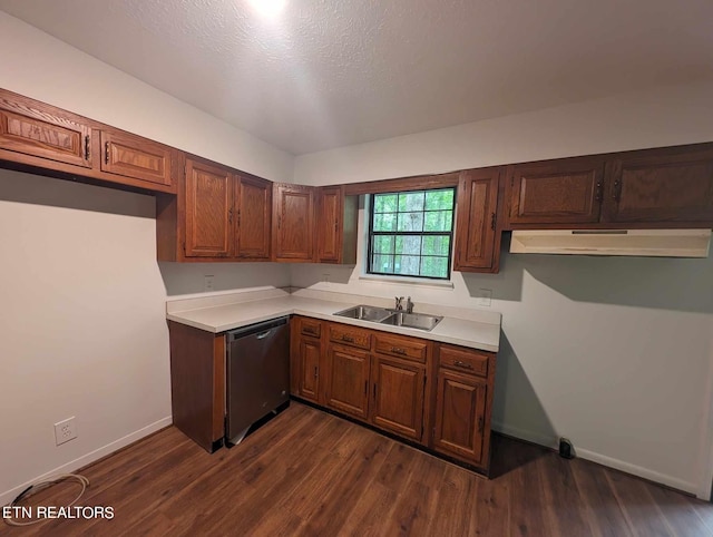 kitchen featuring a textured ceiling, dishwasher, sink, and dark hardwood / wood-style floors