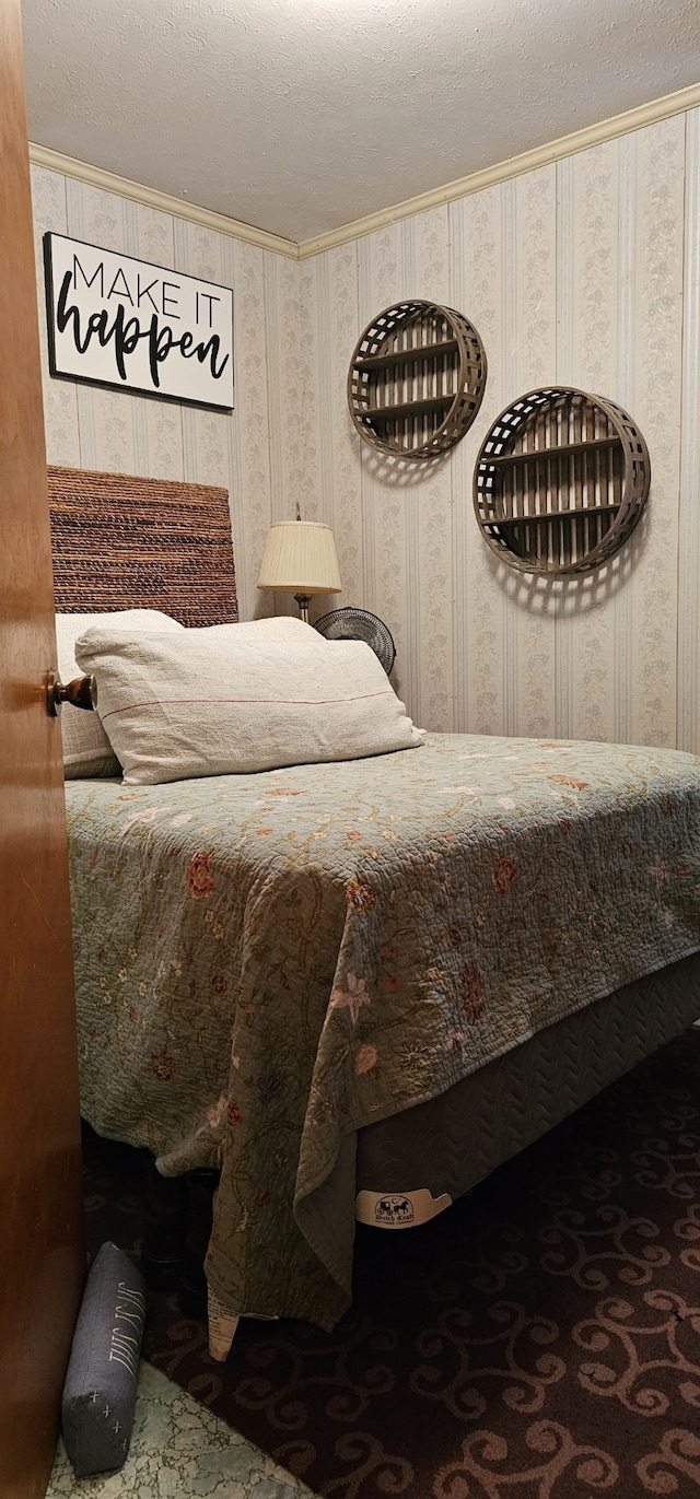 carpeted bedroom with a textured ceiling