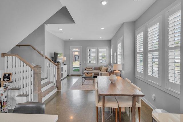 dining space with concrete floors