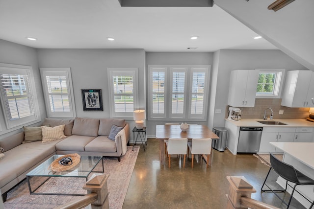 living room with sink and a healthy amount of sunlight