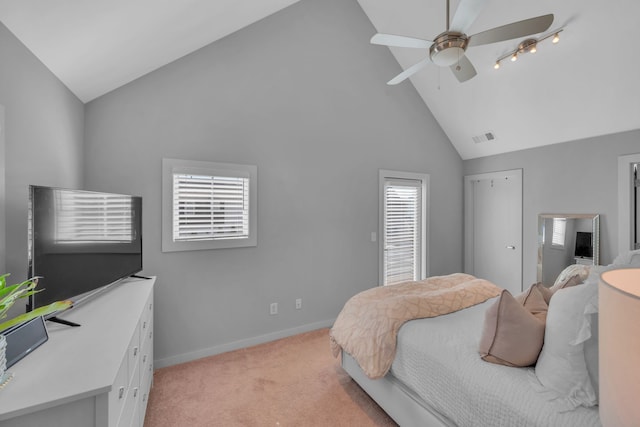 carpeted bedroom with high vaulted ceiling and ceiling fan