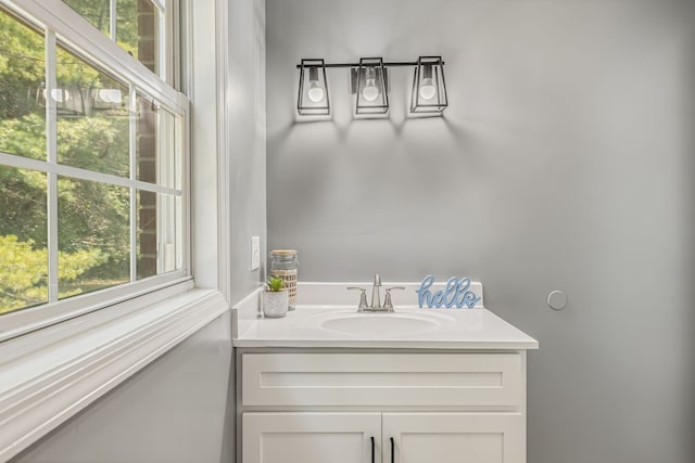 bathroom with vanity and a wealth of natural light