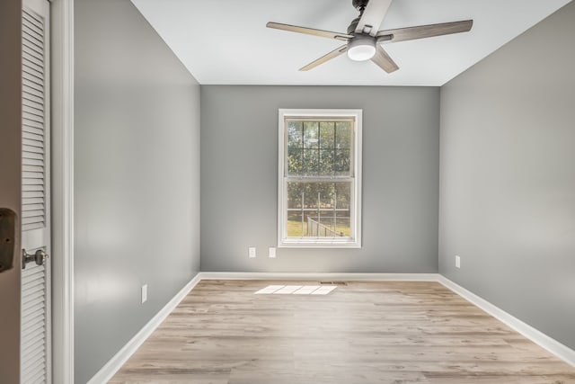 spare room featuring light hardwood / wood-style flooring and ceiling fan