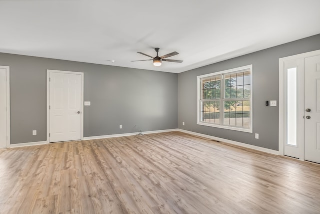 spare room with ceiling fan and light hardwood / wood-style floors