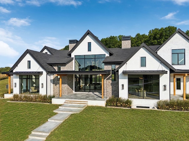 modern inspired farmhouse featuring a front lawn