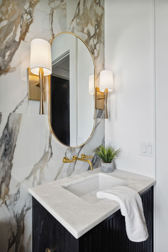 bathroom with decorative backsplash and vanity