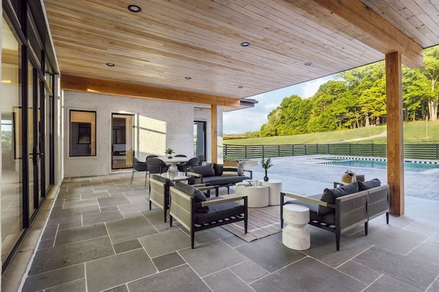 view of patio with a fenced in pool