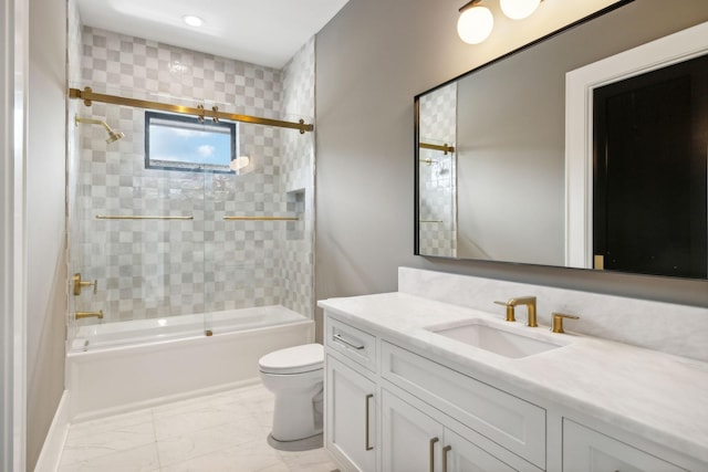 full bathroom featuring vanity, toilet, and bath / shower combo with glass door