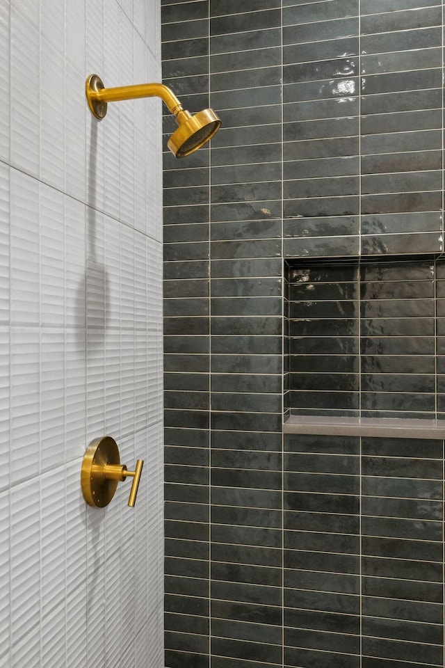 room details featuring a tile shower