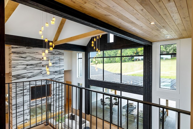 corridor featuring vaulted ceiling with beams, wood-type flooring, and wood ceiling