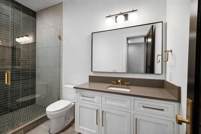 bathroom with tile patterned floors, vanity, toilet, and walk in shower