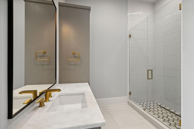 bathroom with tile patterned floors, vanity, and a shower with shower door