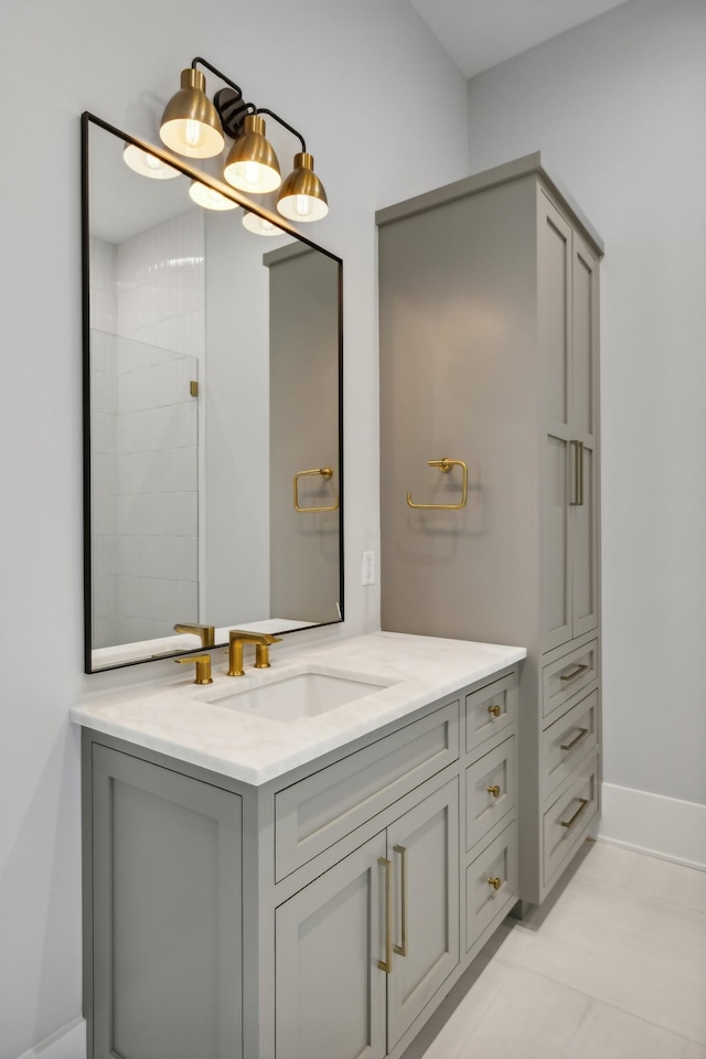 bathroom with tile patterned flooring and vanity