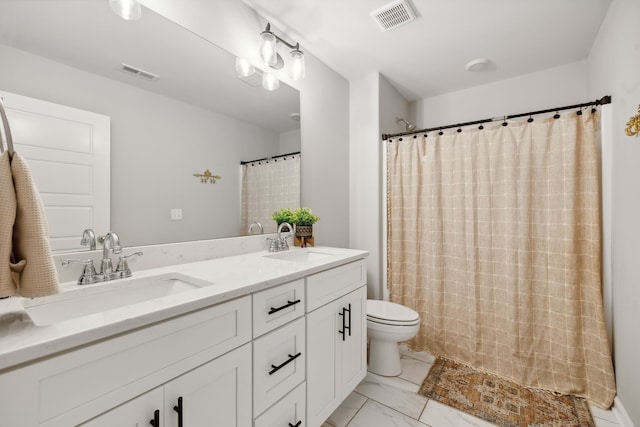 bathroom with walk in shower, toilet, and vanity