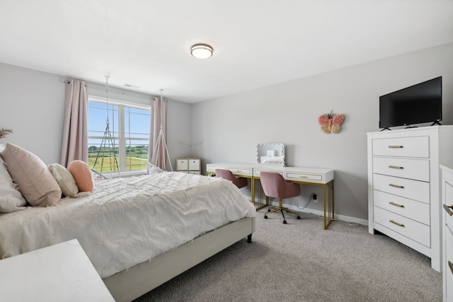 bedroom with light colored carpet