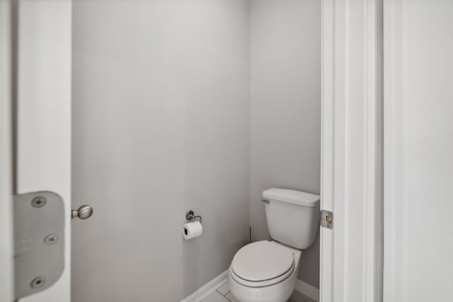 bathroom with tile patterned flooring and toilet