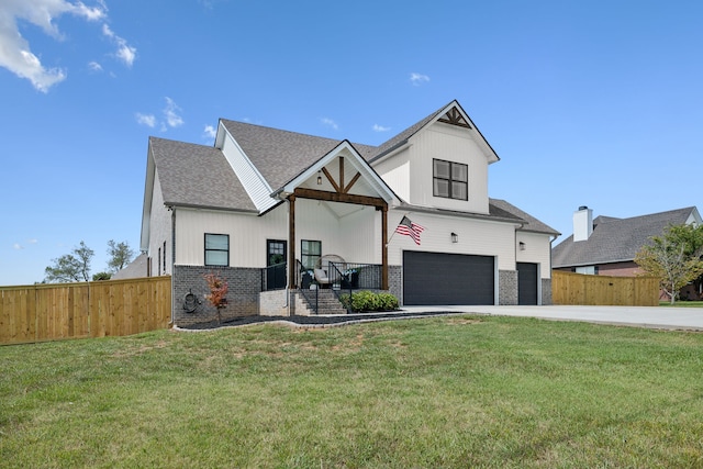 modern inspired farmhouse featuring a garage and a front lawn