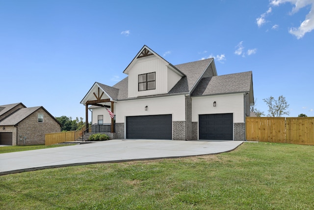 view of front of property with a garage and a front yard