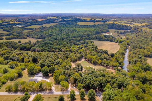 aerial view featuring a wooded view