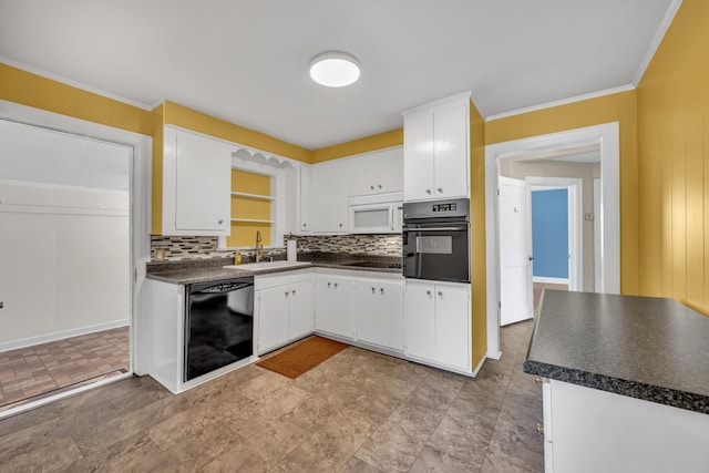 kitchen with black appliances, sink, and white cabinetry