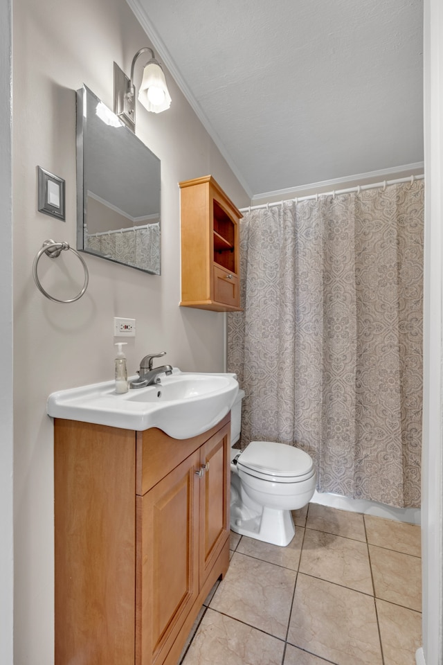 bathroom with tile patterned flooring, vanity, toilet, and ornamental molding