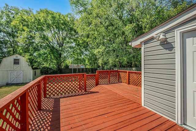 wooden terrace featuring a storage shed