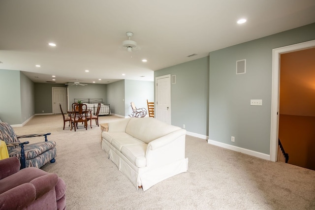 living room featuring ceiling fan and light carpet