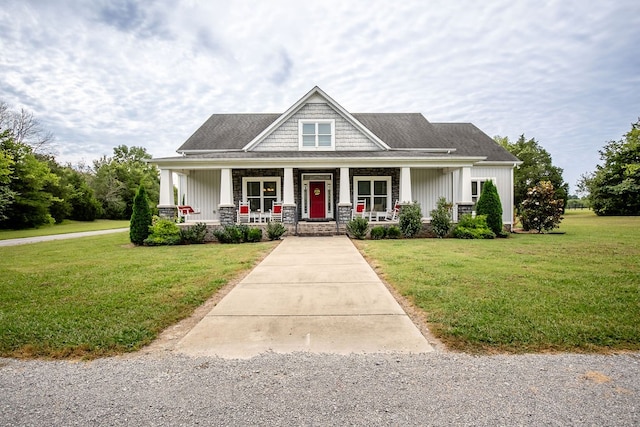 craftsman-style home with a front yard and covered porch