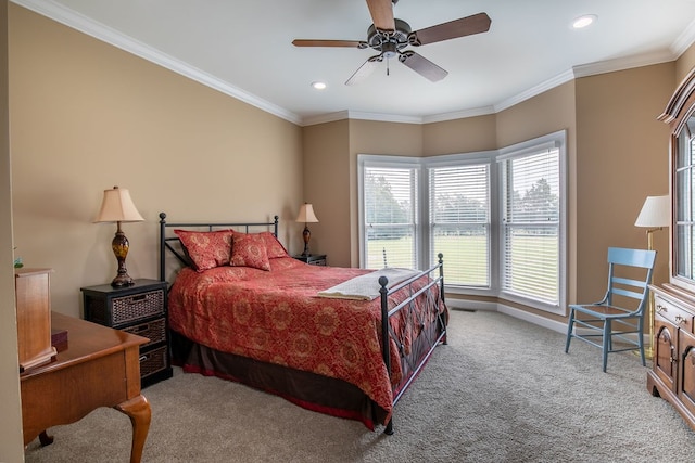 bedroom featuring ceiling fan, light colored carpet, and crown molding